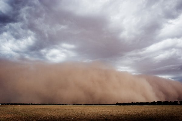 A dust storm approaches the town of Nevertire, central NSW, Australia.